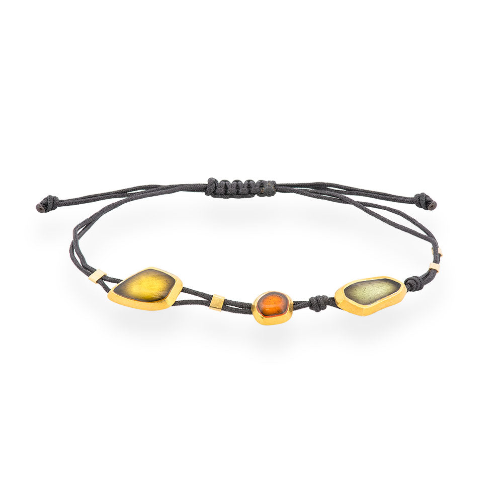 Braccialetto nero fatto a mano con elementi in argento placcato oro e smalto verde e arancione Seaglass